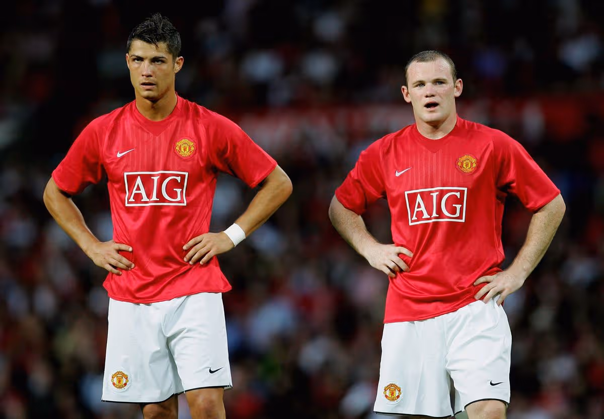 Cristiano Ronaldo and Wayne Rooney in Manchester United shirts at Old Trafford in 2007.